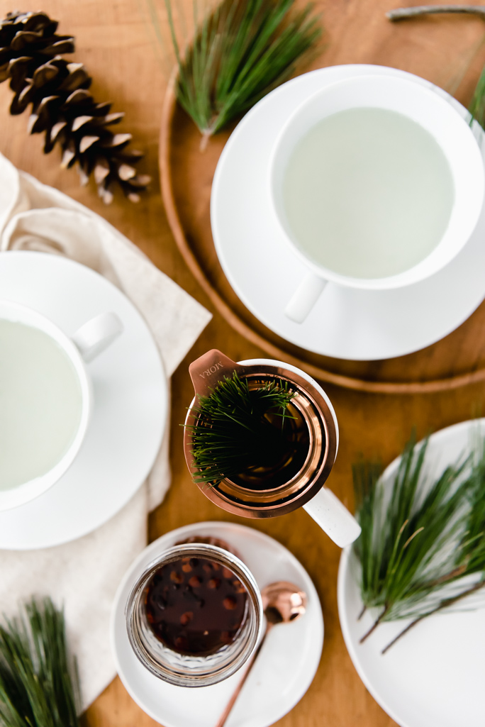 pine tea with many cups and honey