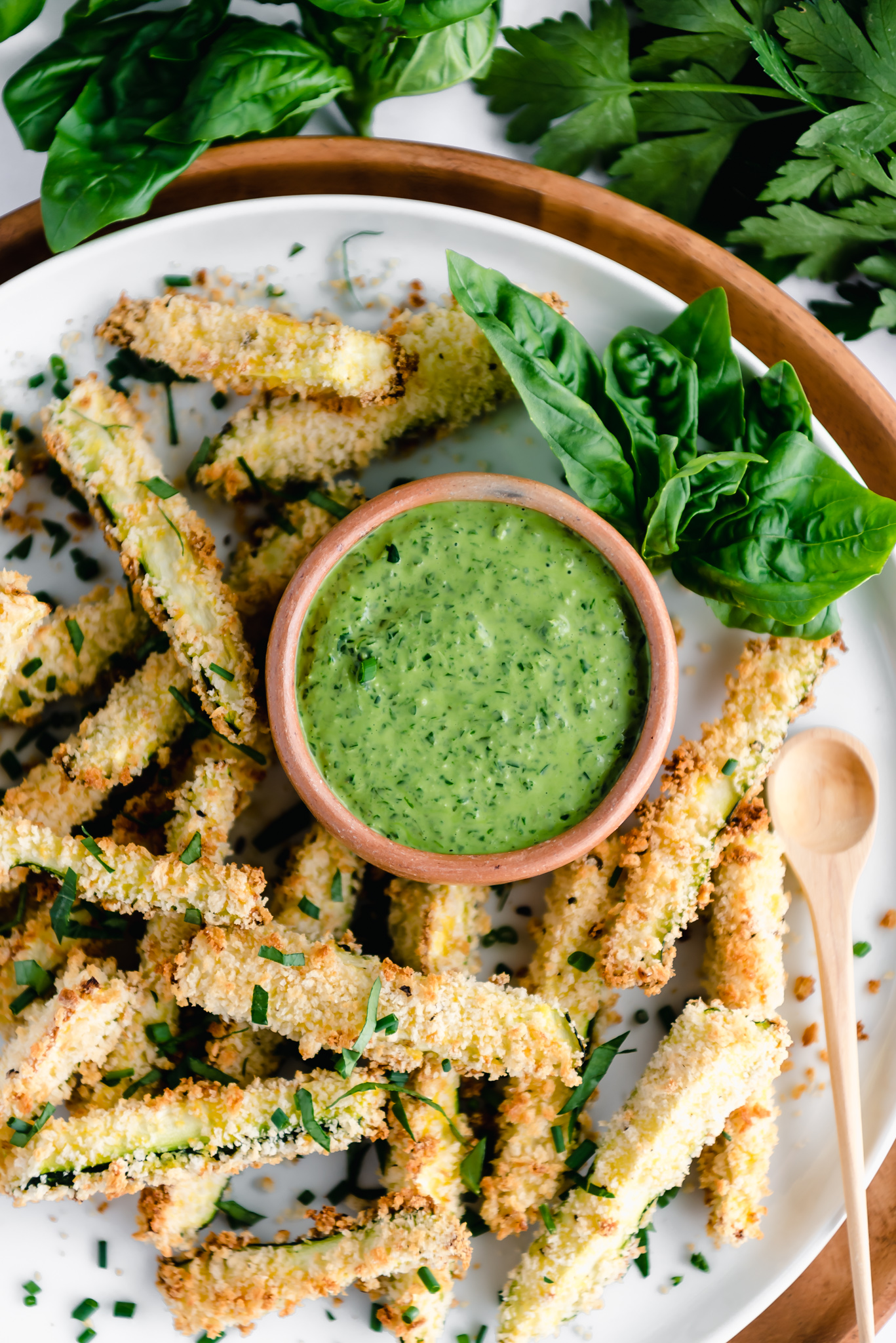 zucchini fries sprinkled with fresh herbs and green goddess dressing
